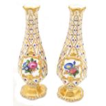 KPM; a pair of 19th century hand painted hexagonal pedestal vases, each with central cabochons