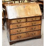 A George III walnut bureau, the fall-front above two short and three long drawers, raised on bracket