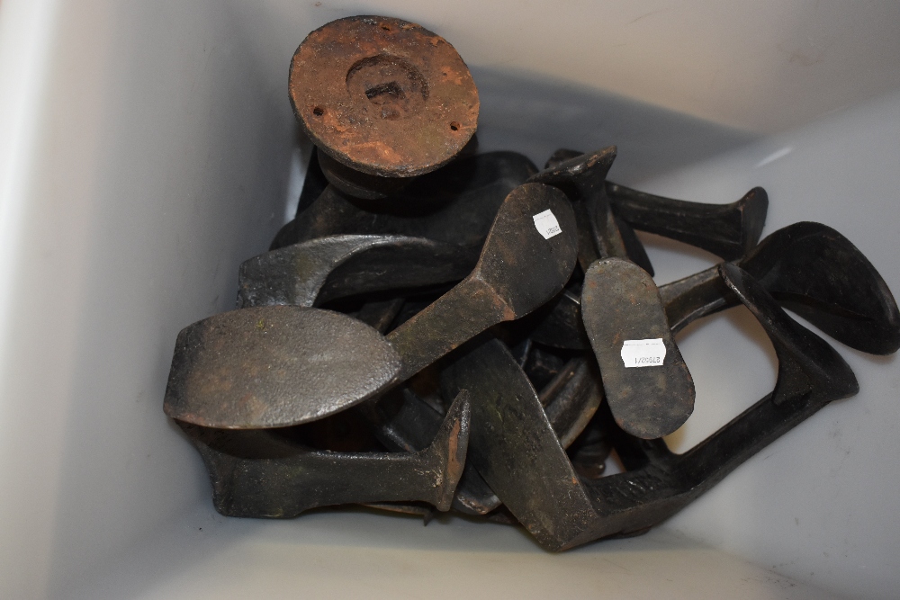 A group of late 19th/early 20th century cast iron shoe lasts, some with stamped marks, including one