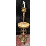 A late 19th century gilt metal standard lamp with circular marble plinth, raised above urn shaped