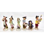 A 20th century Continental handpainted porcelain Meissen-type six piece monkey orchestra with gilt