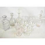 A small collection of glass including a pair of decanters with mushroom stoppers, two further