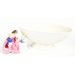ROYAL DOULTON; a figurine HN2059 'The Bedtime Story', height 12cm together with a Wedgwood