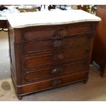 A Victorian mahogany serpentine marble topped chest of five drawers with berry and leaf handles on