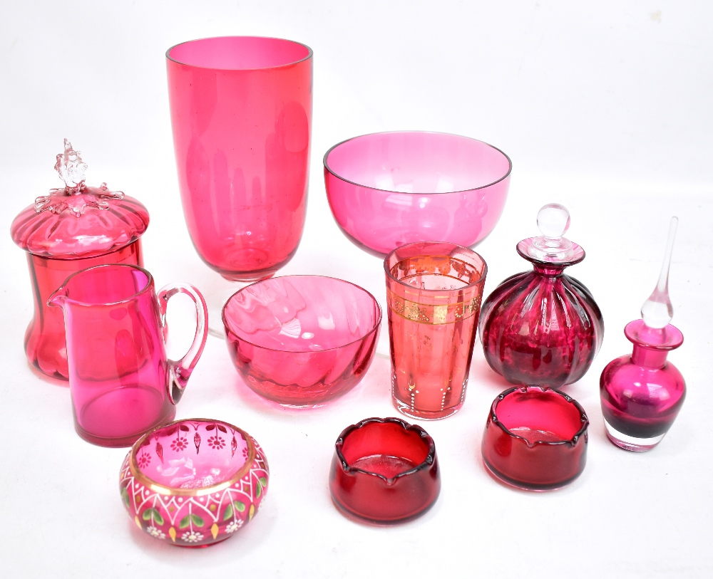 A small group of cranberry glass including vase, lidded scent bottles, bowls etc, two with gilt