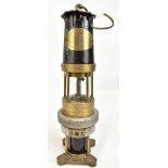 NAYLOR OF WIGAN; an early 20th century 'Spiralarm' miner's safety lamp with aluminium bonnet,