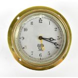 SMITHS; a vintage car dashboard clock, the circular silvered dial set with Arabic numerals, in