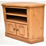 A pine media cabinet with two shelves above twin cupboard drawers, approx 85 x 115 x 60cm.Additional