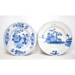 An 18th century tin glazed Delft charger, painted in underglaze blue with landscape scene,