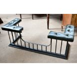 A 19th century wrought iron club fender with green leatherette seat and corner cushions, height