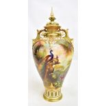 WILLIAM JARMAN FOR ROYAL WORCESTER; a fine hand painted twin handled pedestal lidded vase painted
