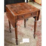 A Victorian mahogany drop leaf Pembroke table with single end drawer, raised on column supports