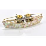 An Edwardian novelty desk stand modelled in the form of a boat with mother of pearl decoration,