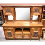 A Victorian oak and pollard oak mirror back sideboard, the upper section with a central bevelled