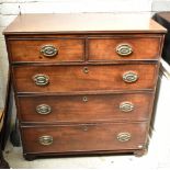 A George III mahogany chest of two short over three long drawers raised on bun feet, height 98.