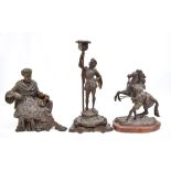 A late 19th century bronze clock surmount depicting Socrates, height 23cm, a figural candlestick,