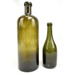 An early to mid 20th century wine bottle with indistinct stamp to base, height 25.5cm, and a smaller