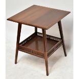 JAS SHOOLBRED; an Arts & Crafts mahogany side table, the under tier with pierced gallery, raised