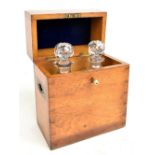 An Edwardian oak decanter box with dovetailed joints and recessed brass carrying handles with