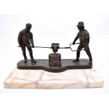 An early 20th century German bronze figure group of two foundry workers inscribed 'Gelsenkirshener