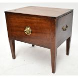 A 19th century mahogany commode stool, the hinged cover enclosing an empty compartment with three