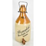 A late 19th century two-tone advertising flagon, entitled 'Alexander's Pure Table Waters Kendal',