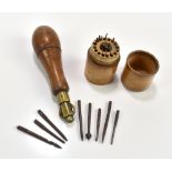 A Victorian treen screwdriver with brass mount, the handle unscrews to reveal a fitted compartment