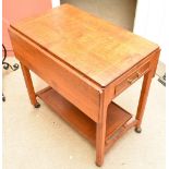 IAN LAVAL; an inlaid oak drop leaf dinner trolley with a drawer to each end raised on block supports