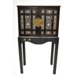 A late 17th/early 18th century Indo-Portuguese ebony and ivory inlaid cabinet on stand, the