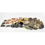 A collection of geodes and minerals including pectolite, satin spar selenite and selenite