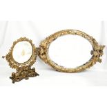 A 19th century gilt gesso wall mirror with carved floral detail, height 93cm, together with a cast