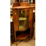 An Edwardian inlaid bow front free standing corner cabinet, with floral detail, height 131cm,
