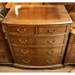 A reproduction mahogany bowfronted chest of two short over three long drawers on bracket supports,