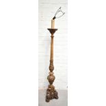 A mid-20th century carved walnut standard lamp raised on paw feet, height 163cm.Additional