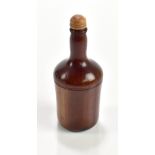 A 19th century novelty treen nutmeg grater modelled as a bottle, with later stopper, height 8cm.