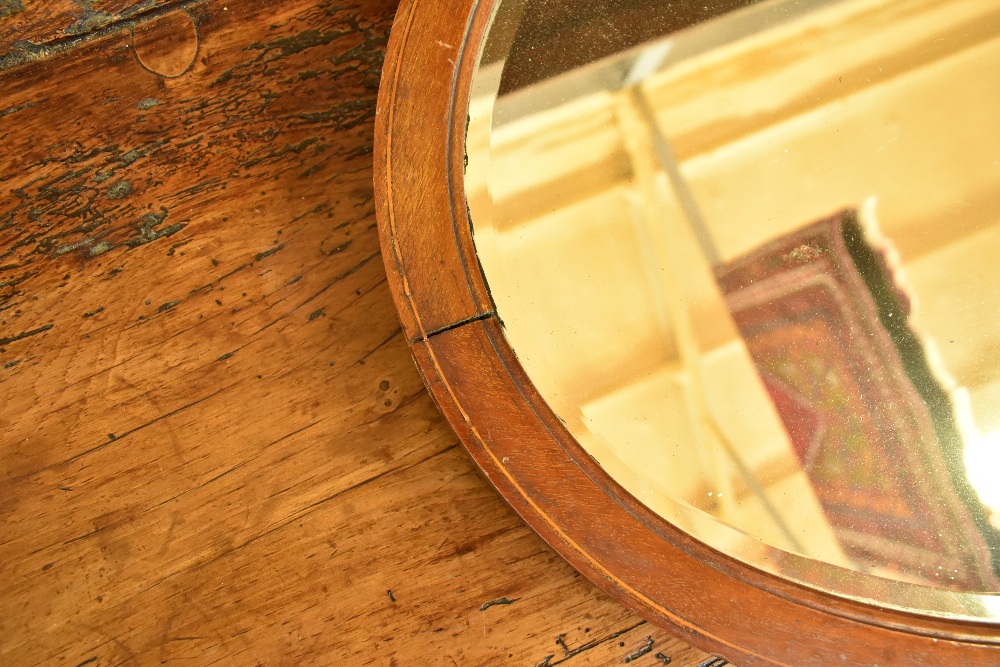 An Edwardian mahogany and line inlaid oval wall mirror with bevelled plate, 69 x 49cm.Additional - Image 2 of 3