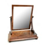 A 19th century mahogany toilet mirror on compressed bun feet, 60 x 71cm.Additional