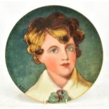 WORCESTER ROYAL PORCELAIN WORKS; a wall plate hand painted with portrait of a young boy, signed CKR,