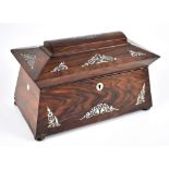 A 19th century rosewood mother of pearl inlaid sarcophagus form tea caddy with two lidded