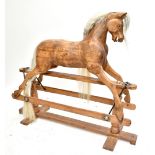 LINES BROTHERS LTD; an early/mid-20th century 'Sportiboy' model rocking horse with glass eyes and