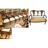 An Edwardian mahogany, rosewood and marquetry inlaid salon suite comprising two-seater settee, elbow