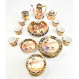 NORITAKE; a hand painted 24 piece coffee and table service decorated in a desert scene pattern.