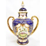COALPORT; a late 19th/early 20th century twin handled pedestal lidded vase painted with exotic birds