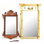 A late 19th/early 20th century gilt pier mirror with decorative frieze and bevelled glass flanked by