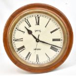 An early to mid 20th century wall clock, the circular dial set with printed Roman numerals and