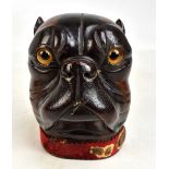 A 19th century lignum vitae novelty tobacco jar modelled as a dog's head with amber glass eyes,