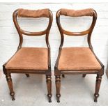 A set of five early Victorian rosewood kidney shaped balloon back dining chairs with padded drop-