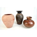 Three contemporary ceramic vases to include an example with original label Banyu Embulan Art Shop,