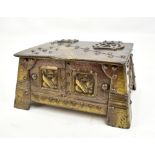 An Arts & Crafts metal casket of shaped rectangular form, with applied stylised hinges and studded