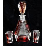 An Art Deco flashed glass three piece drinking set comprising decanter, height 27.5cm and two shot